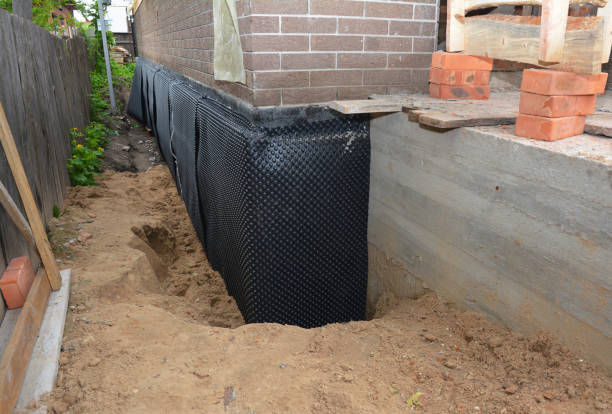 SJ Waterproofing Pros technician performing targeted Emergency Waterproofing assessment in Rossville, GA